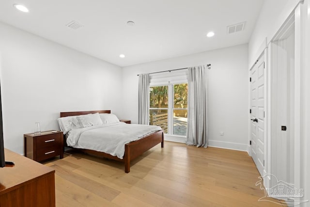 bedroom with light wood-type flooring