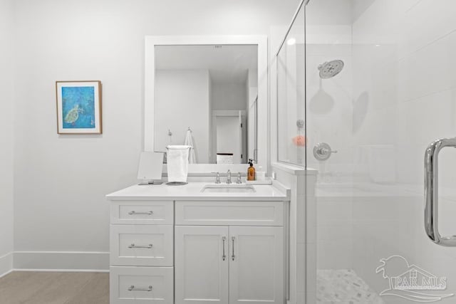 bathroom with tile patterned flooring, vanity, and an enclosed shower