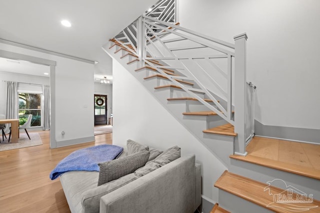 staircase featuring hardwood / wood-style flooring