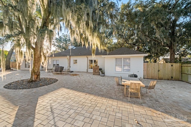 rear view of property featuring a patio