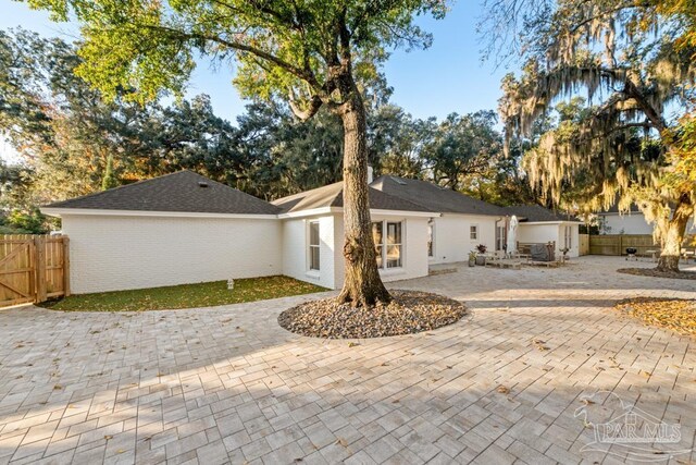 back of house with a patio