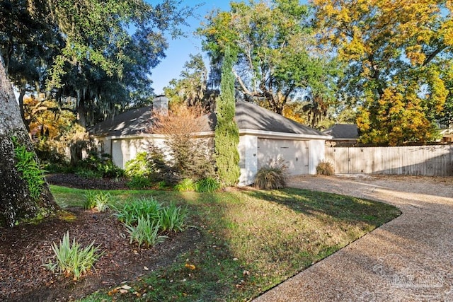 view of property exterior with a garage