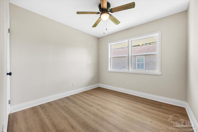 empty room featuring ceiling fan and light hardwood / wood-style floors