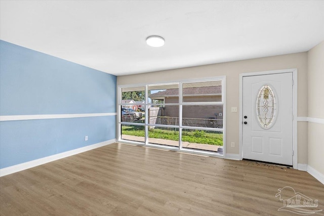 foyer with light hardwood / wood-style floors