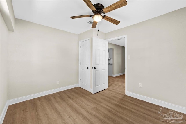 unfurnished bedroom with wood-type flooring and ceiling fan