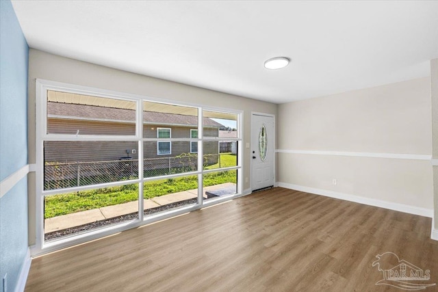 empty room featuring hardwood / wood-style flooring