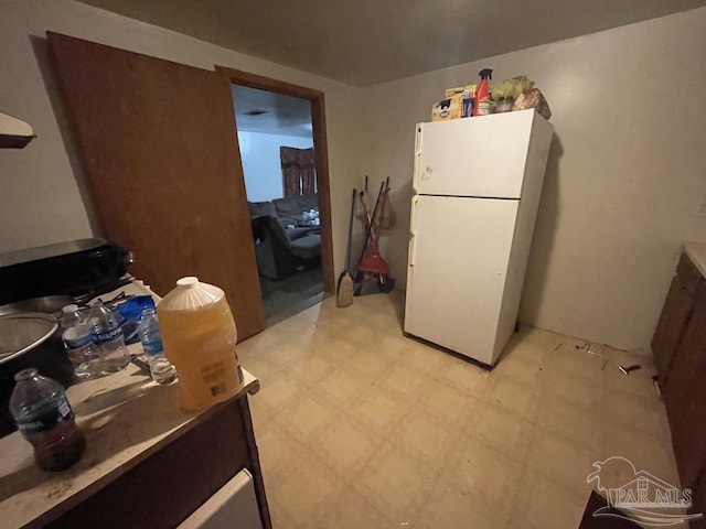 1500 N Hayne St, Pensacola, FL 32503 - kitchen with freestanding refrigerator and light floors