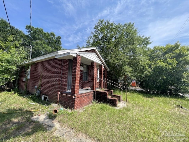 1500 N Hayne St, Pensacola, FL 32503 - view of side of home featuring brick siding
