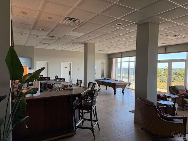 rec room with a paneled ceiling, french doors, and billiards