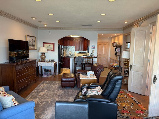 living room with ornamental molding