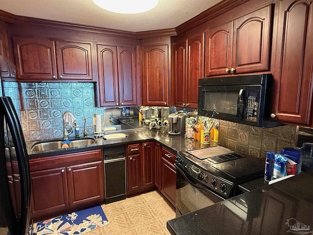 kitchen featuring black appliances, decorative backsplash, and sink