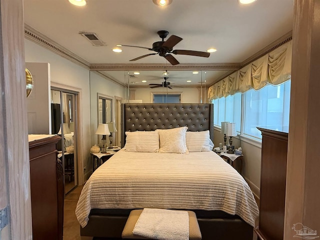 bedroom with ceiling fan and ornamental molding