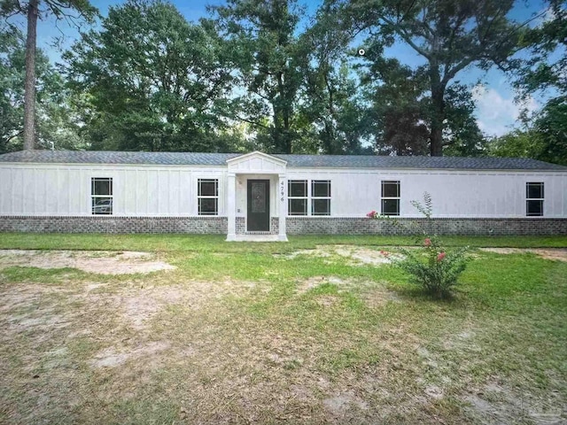 4796 Guernsey Rd, Pace, FL 32571 - manufactured / mobile home with brick siding and a front yard