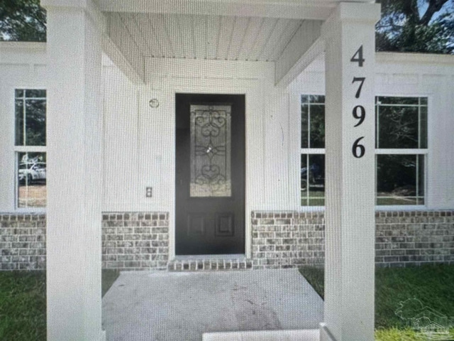 4796 Guernsey Rd, Pace, FL 32571 - property entrance with stone siding and brick siding