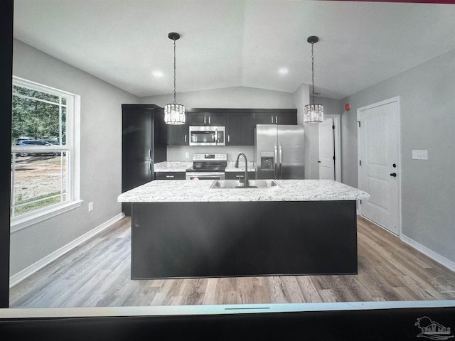 4796 Guernsey Rd, Pace, FL 32571 - kitchen with appliances with stainless steel finishes, a sink, a chandelier, vaulted ceiling, and baseboards