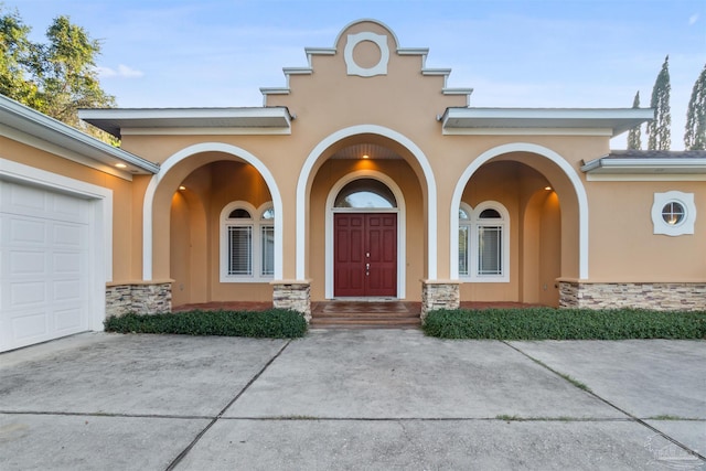 doorway to property featuring a garage