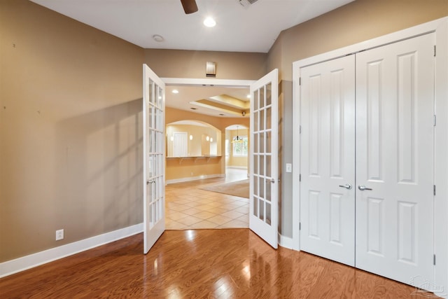 hall featuring french doors and hardwood / wood-style floors