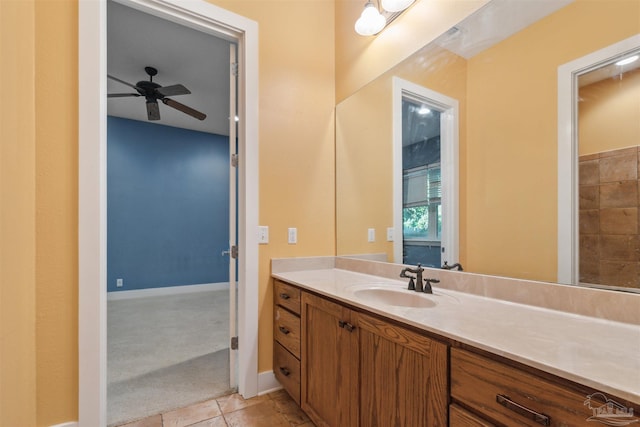 bathroom featuring vanity, ceiling fan, and tile patterned flooring