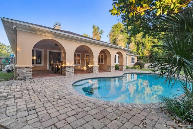 view of swimming pool featuring a patio