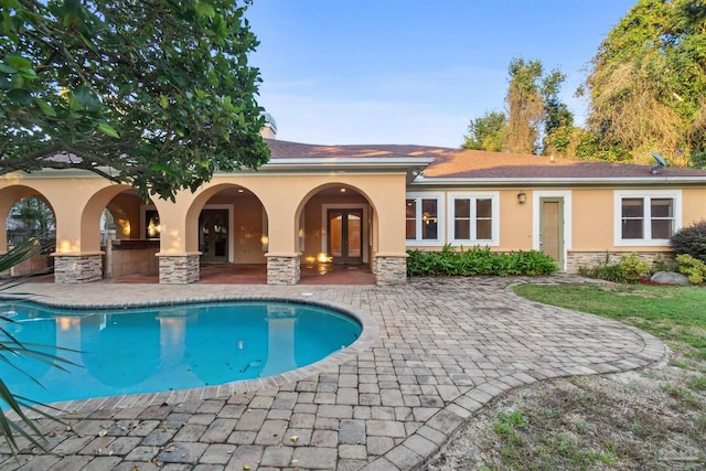 back of property with a patio area