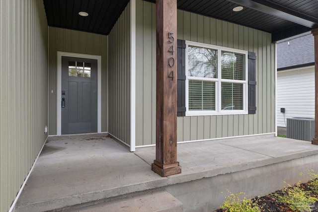 entrance to property featuring cooling unit