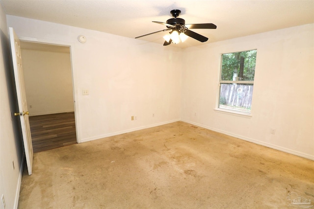 spare room featuring light wood-type flooring and ceiling fan