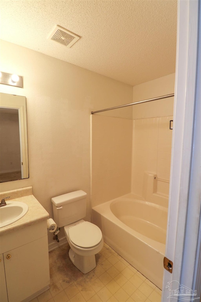 full bathroom featuring vanity, toilet, bathtub / shower combination, and a textured ceiling