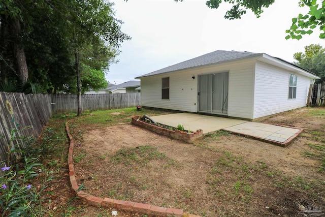 rear view of property with a patio area