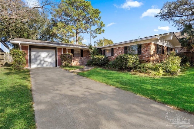 931 Pocahontas Dr, Ft Walton Beach, FL 32547 - ranch-style house featuring a front yard and a garage