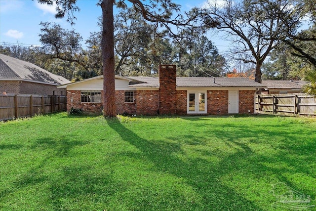 931 Pocahontas Dr, Ft Walton Beach, FL 32547 - back of house featuring a yard and french doors