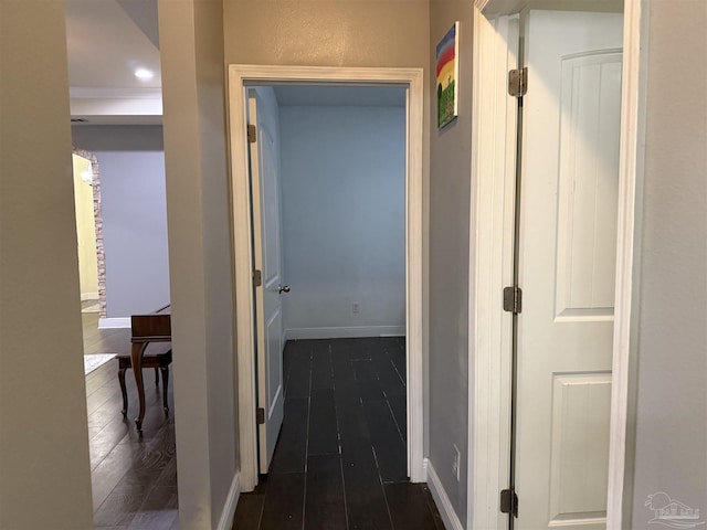 hallway with dark wood-style flooring, recessed lighting, and baseboards