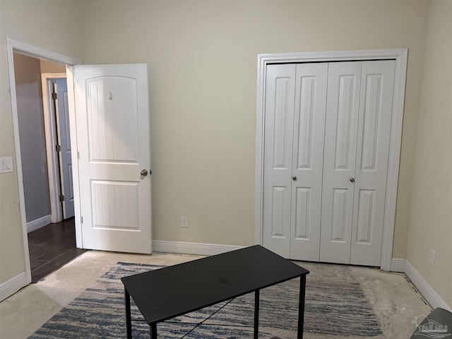 office featuring concrete flooring and baseboards