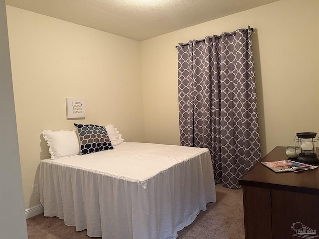 bedroom featuring light colored carpet