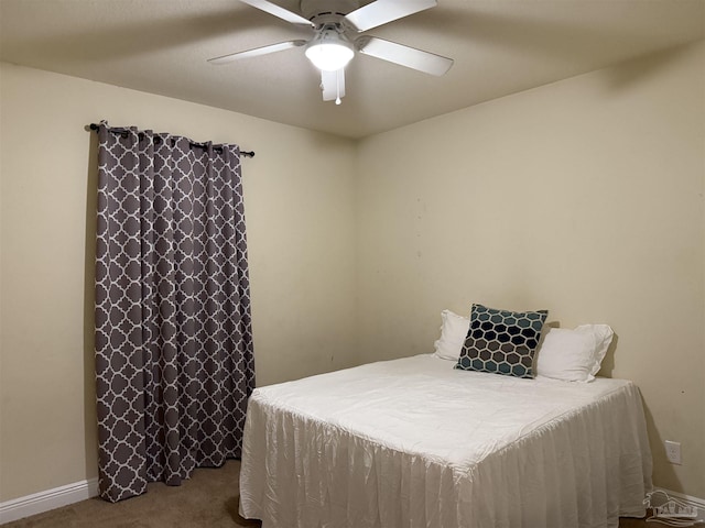 bedroom featuring baseboards, a ceiling fan, and carpet flooring