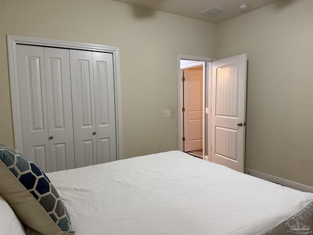 bedroom featuring a closet and baseboards