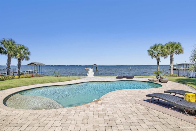 view of pool featuring a patio and a water view