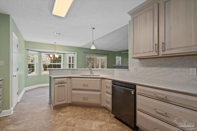 kitchen featuring light brown cabinetry, decorative light fixtures, black dishwasher, sink, and kitchen peninsula