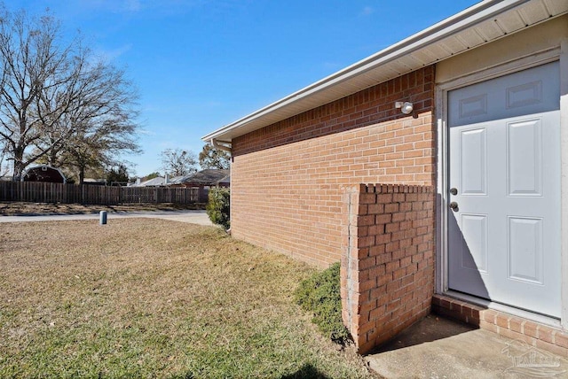 entrance to property with a yard