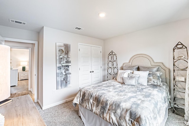 8815 Longmont Way, Milton, FL 32583 - bedroom featuring light colored carpet, a closet, visible vents, and baseboards