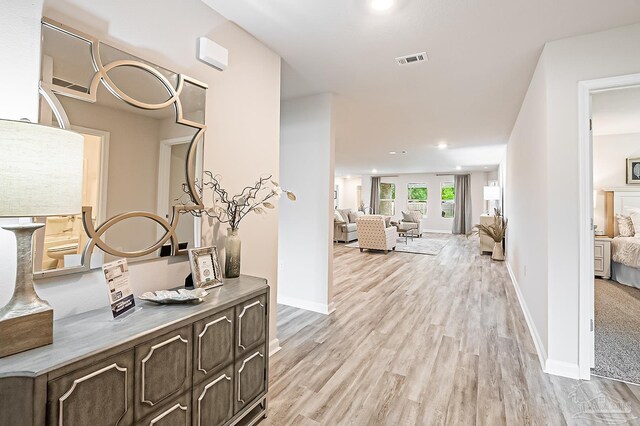 8815 Longmont Way, Milton, FL 32583 - hallway featuring light wood-type flooring, recessed lighting, baseboards, and visible vents