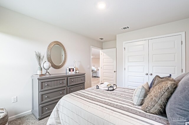 8815 Longmont Way, Milton, FL 32583 - bedroom with light colored carpet, a closet, visible vents, and baseboards
