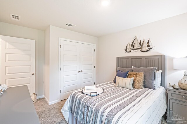 8815 Longmont Way, Milton, FL 32583 - bedroom with light carpet, a closet, baseboards, and visible vents