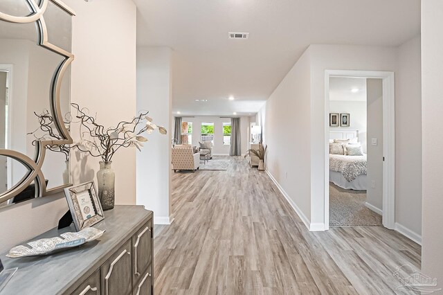 8815 Longmont Way, Milton, FL 32583 - hall featuring light wood-style flooring, baseboards, visible vents, and recessed lighting
