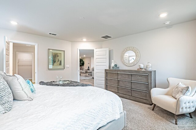 8815 Longmont Way, Milton, FL 32583 - bedroom featuring recessed lighting, visible vents, and a walk in closet