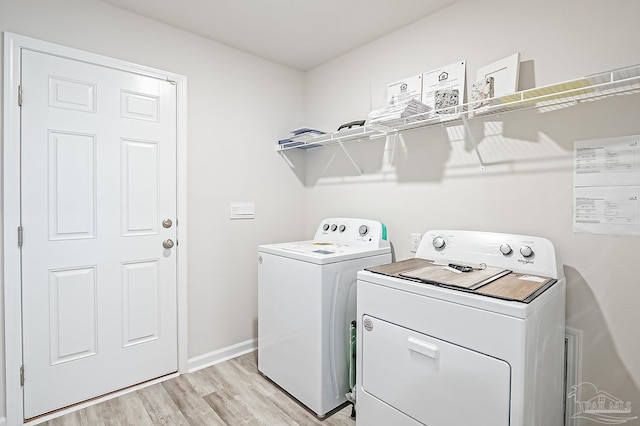 8815 Longmont Way, Milton, FL 32583 - washroom featuring baseboards, light wood-style floors, laundry area, and washer and dryer
