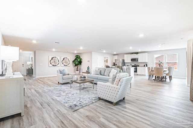 8815 Longmont Way, Milton, FL 32583 - living area with baseboards, recessed lighting, and light wood-type flooring