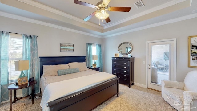 carpeted bedroom featuring a raised ceiling, ceiling fan, crown molding, and access to outside