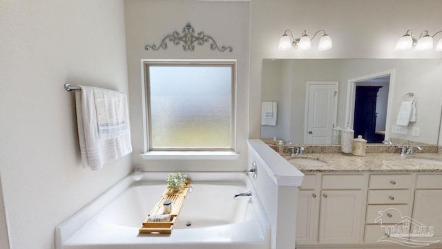 bathroom with vanity and a bathtub