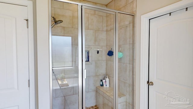 bathroom featuring an enclosed shower