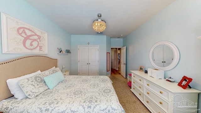 carpeted bedroom featuring a closet